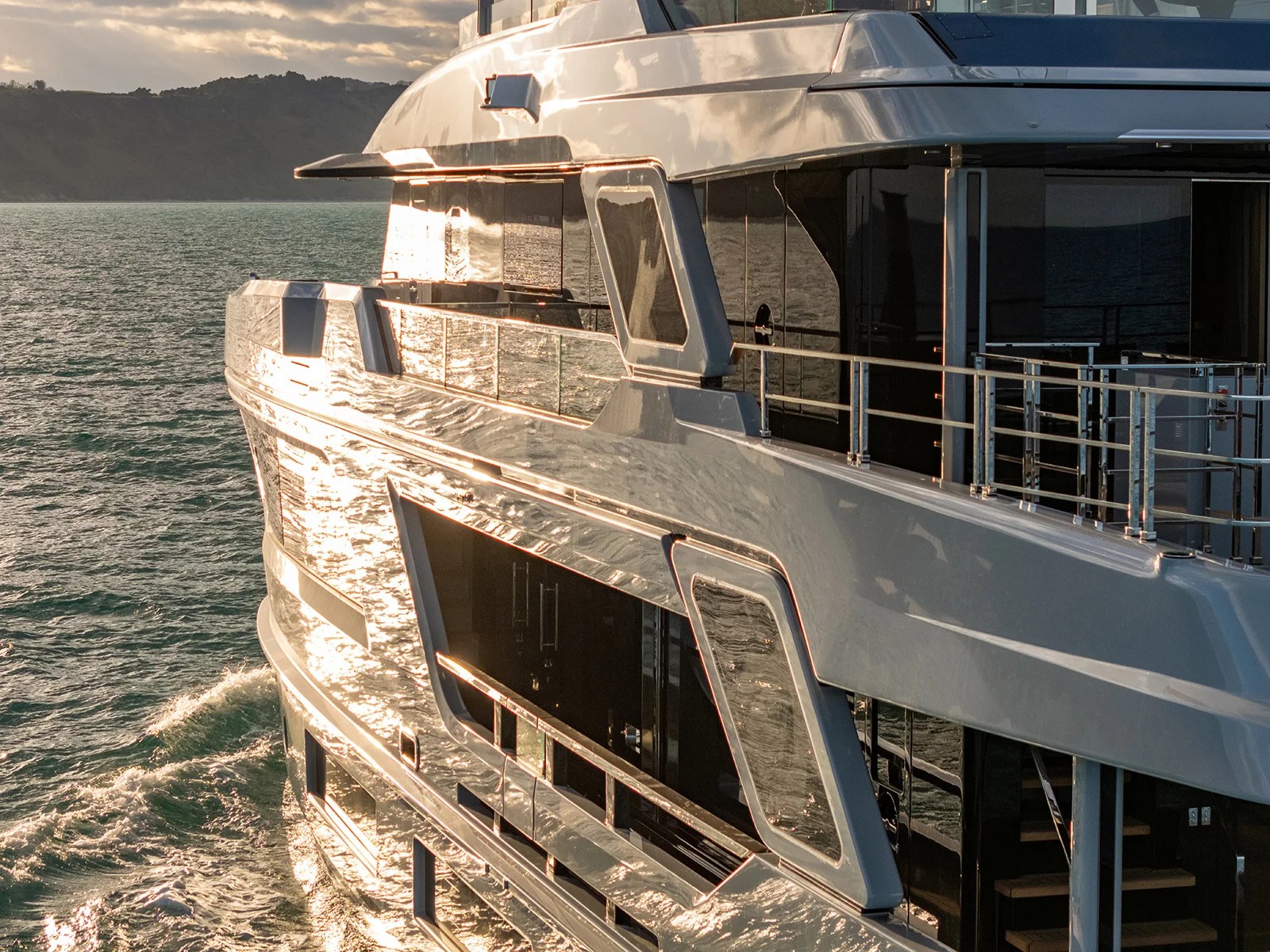 Pazienza hull reflecting golden sunset light on the water
